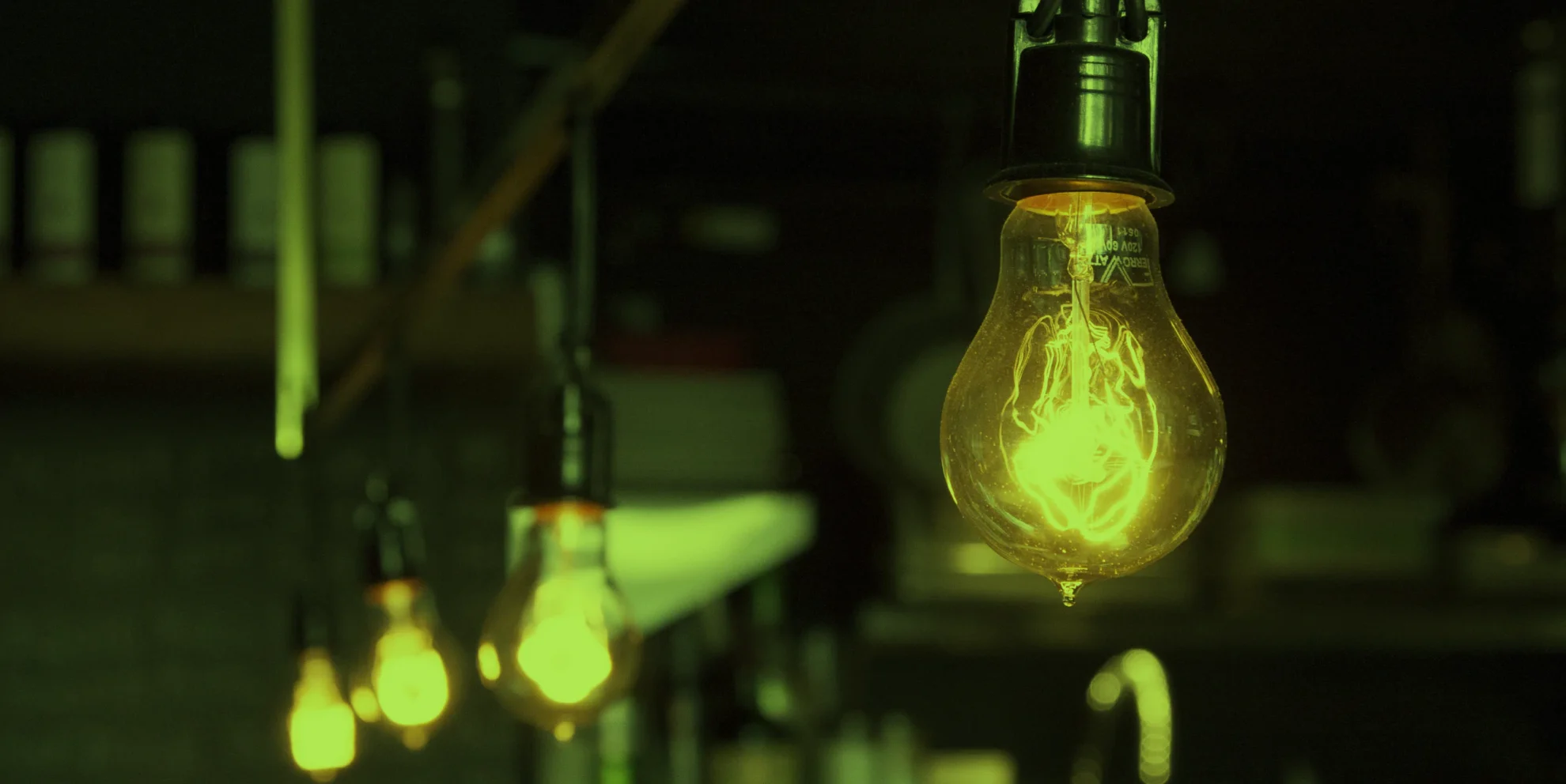 four hanging lightbulbs